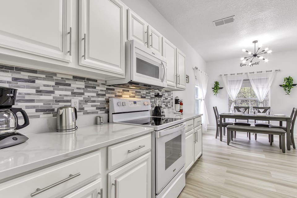 Another view of kitchen and dining area