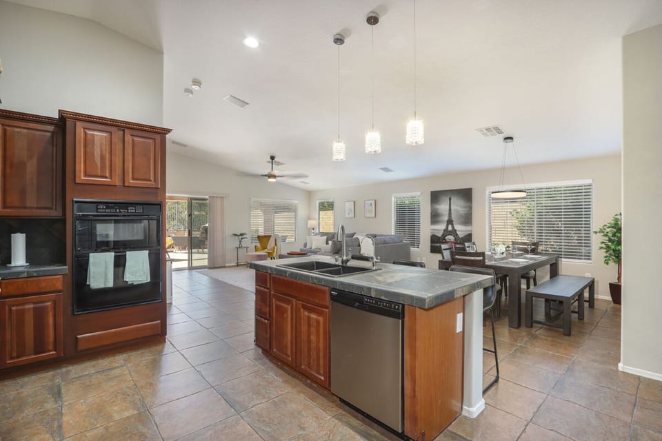Spacious Kitchen overlooks the Dining area for 8..
