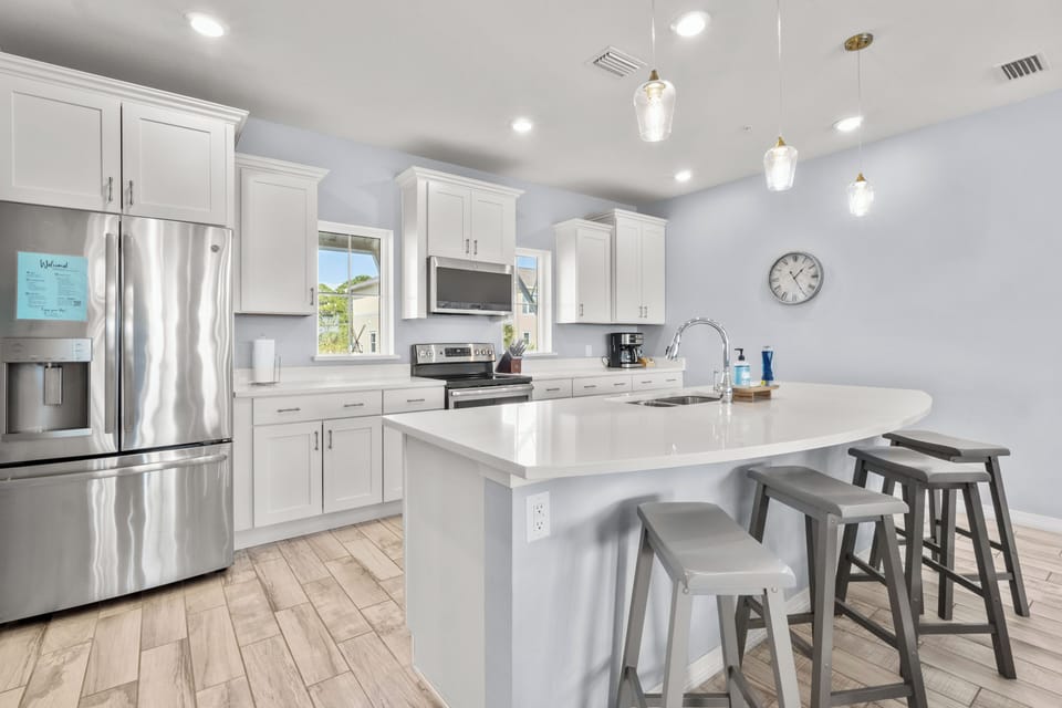 Spacious and fully stocked kitchen with bar seating and coffee center