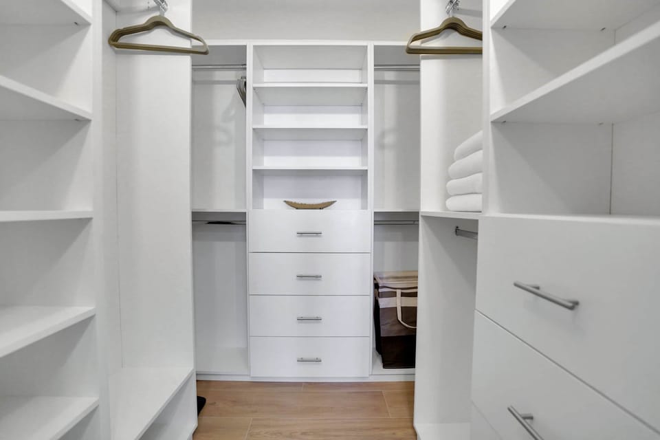 Walk in closet located in the master bedroom suite