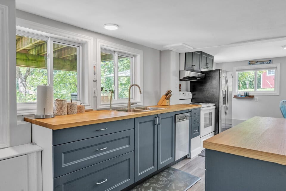 Kitchen windows look right out at the lake!