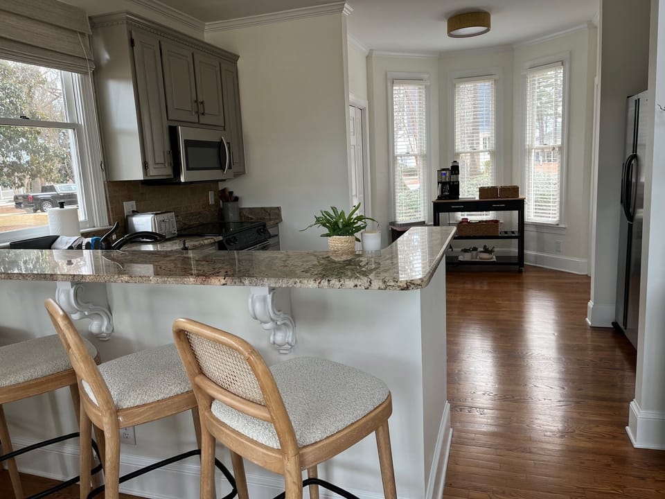 Counter bar with 4 stools and fully stocked kitchen with coffee station