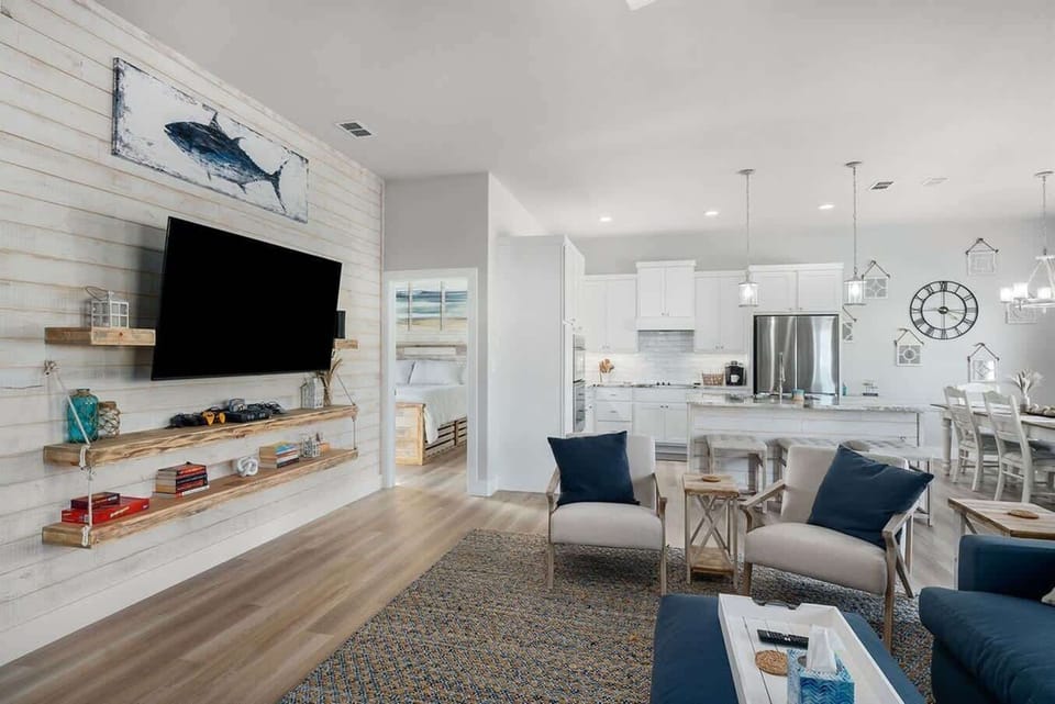 Bright, coastal-inspired living space with open kitchen and modern finishes.