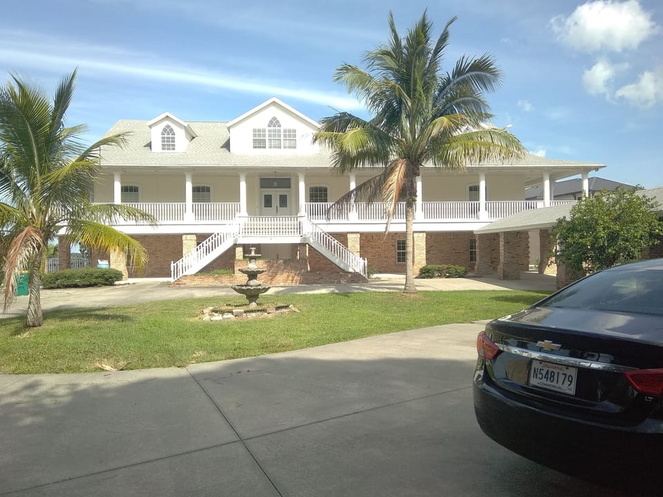 Entrance to apartment located on ground level directly below main staircase. 