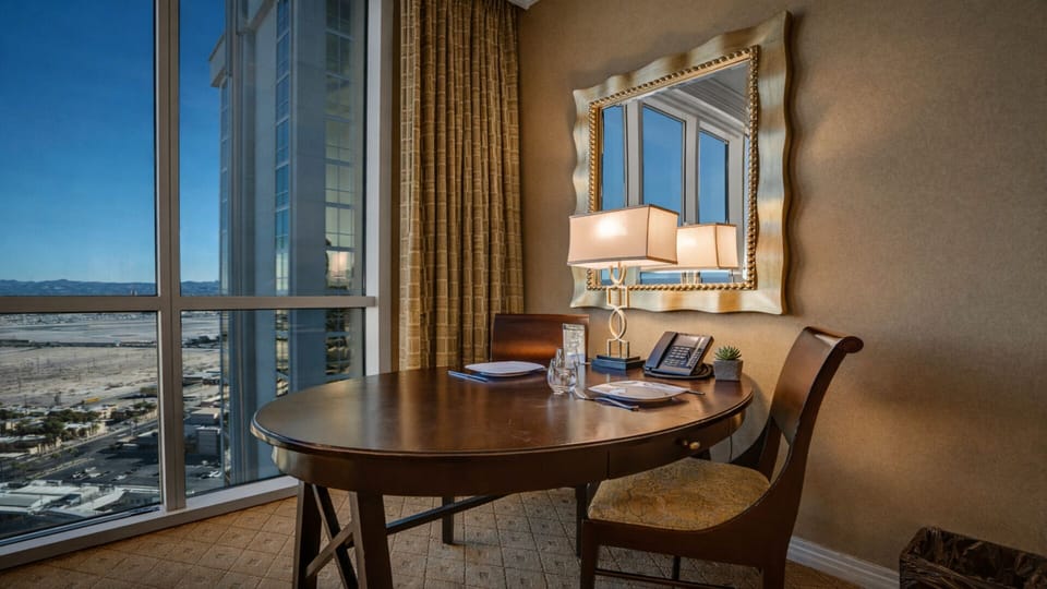 Work or dine with stunning floor-to-ceiling views—your perfect Vegas spot.