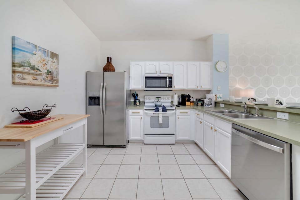 Kitchen stocked with dishes and appliances