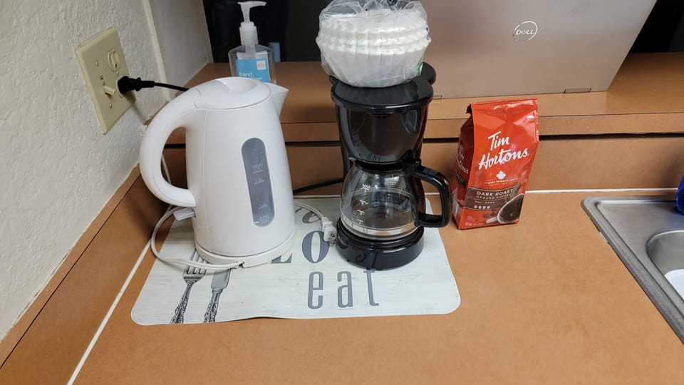 Coffee and cream provided. You will also find water in the refrigerator.