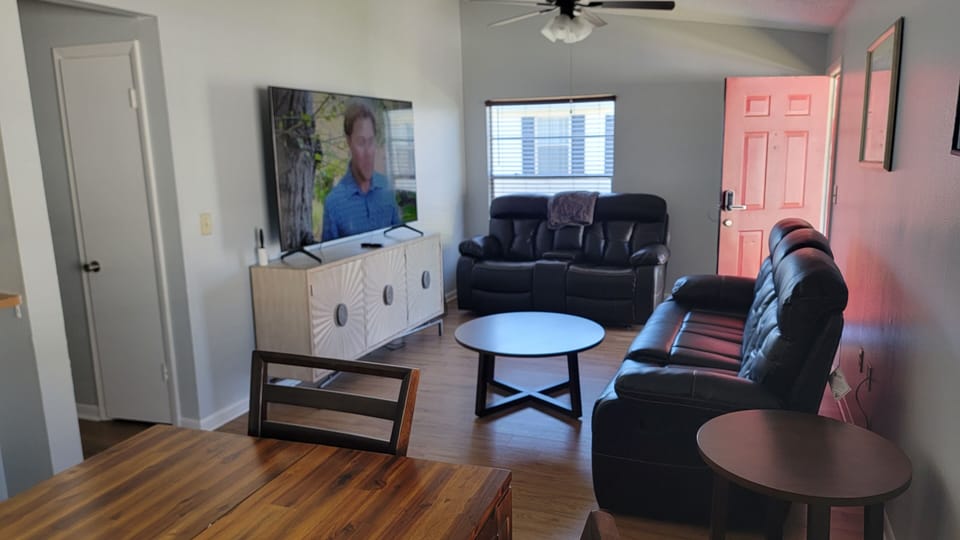 Living room with 75" Samsung smart TV. Spectrum with local channels included. 