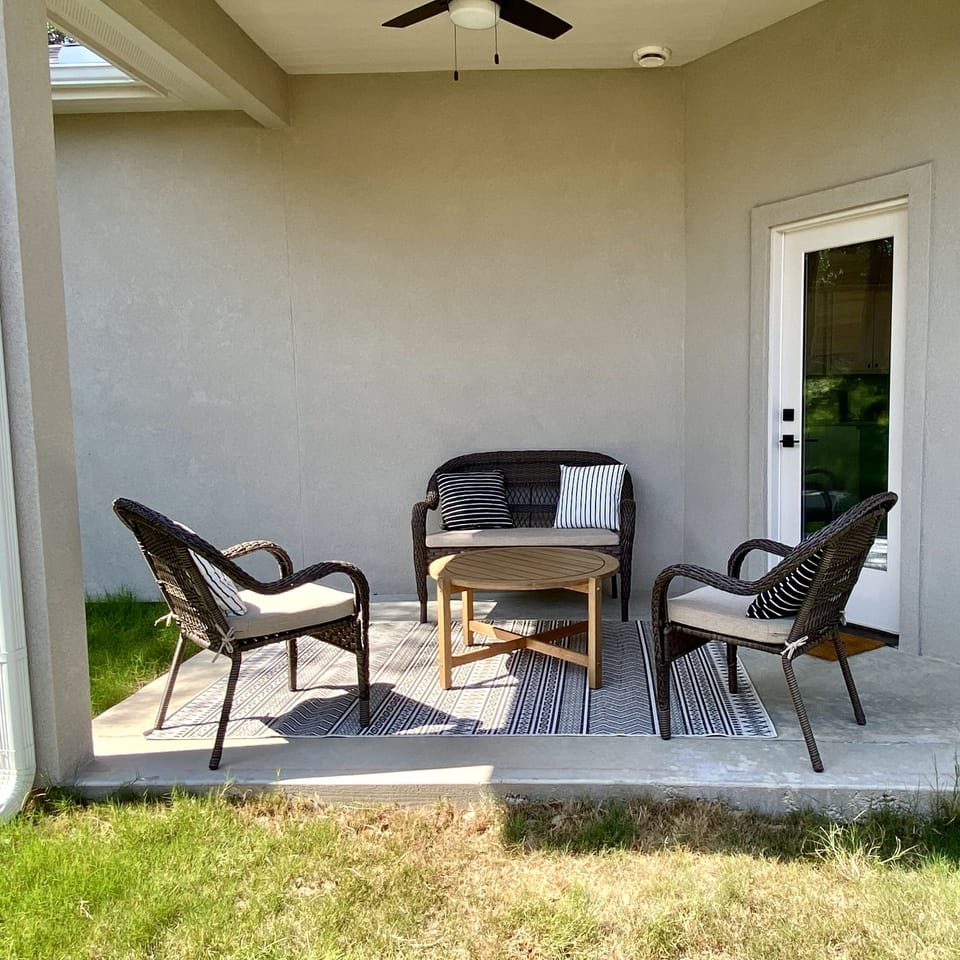 Backyard patio has premium charcoal grill