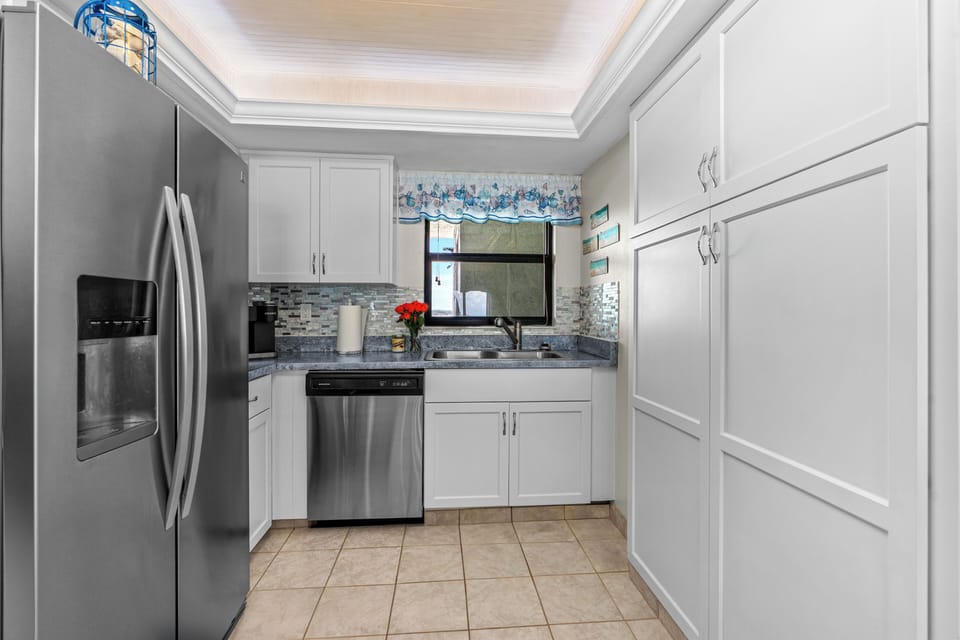 Large kitchen with oversized pantry. New lighting and fan
