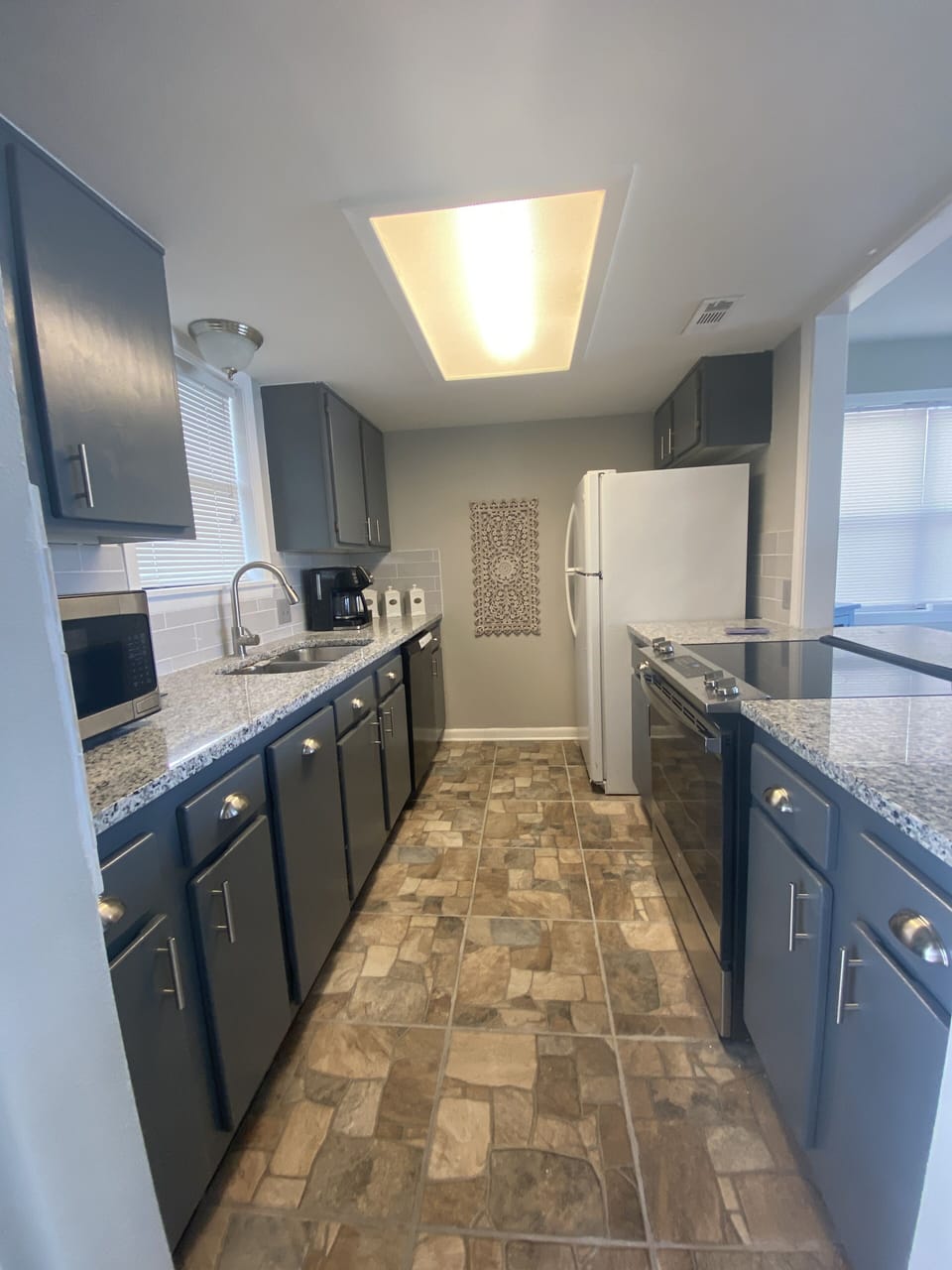 Newly remodeled kitchen. New appliances, granite counters and ceramic tile floor