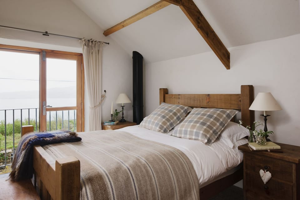 First-floor king bedded room with Juliette balcony and sea views.
