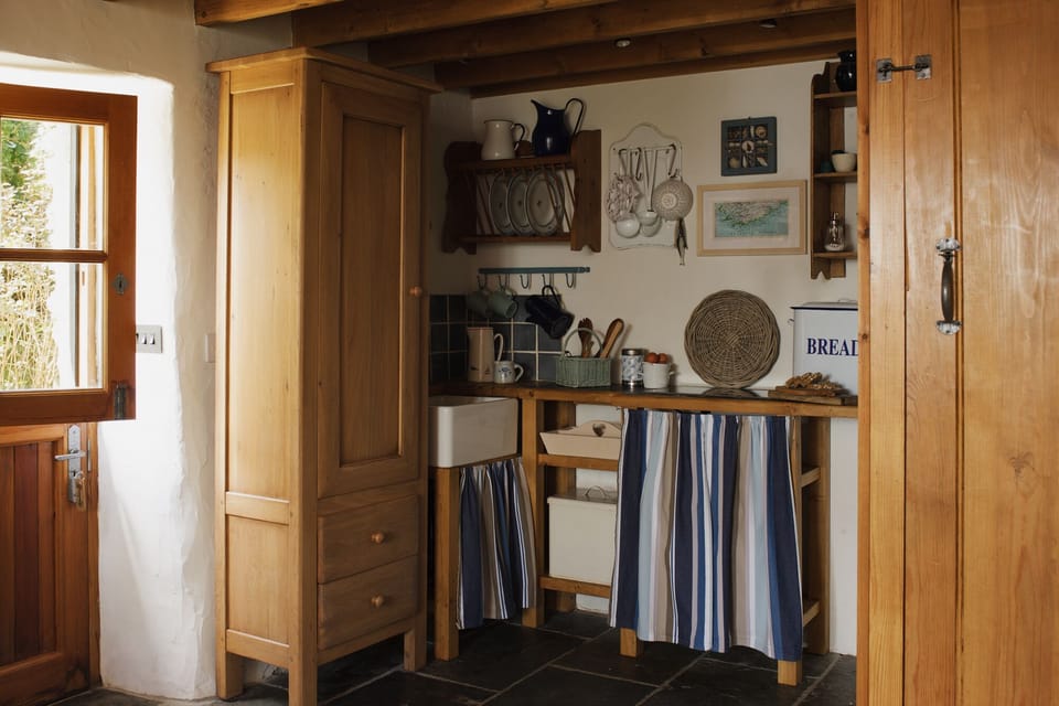 Kitchenette with two-ring hob, combi microwave/oven, toaster, kettle & fridge.