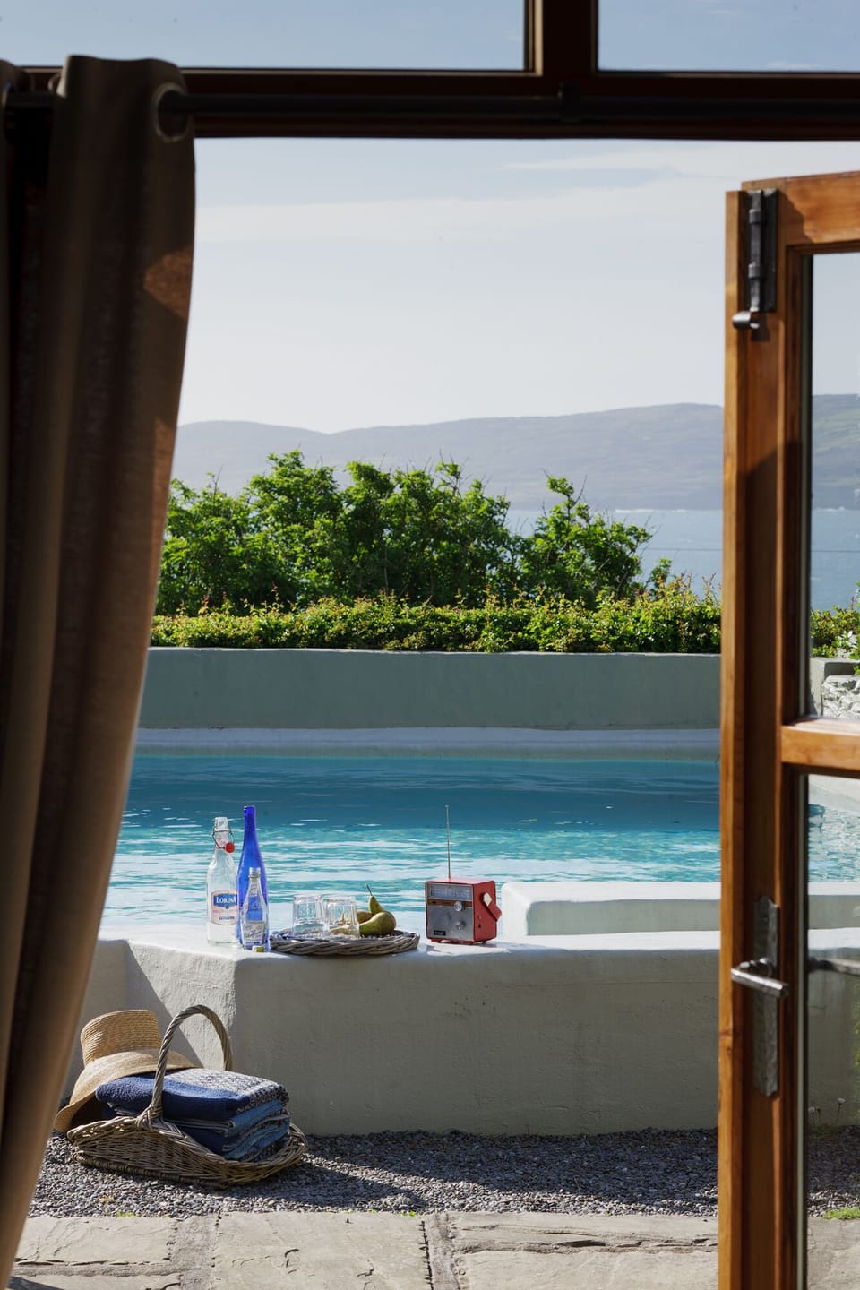 Studio sunroom pool view.