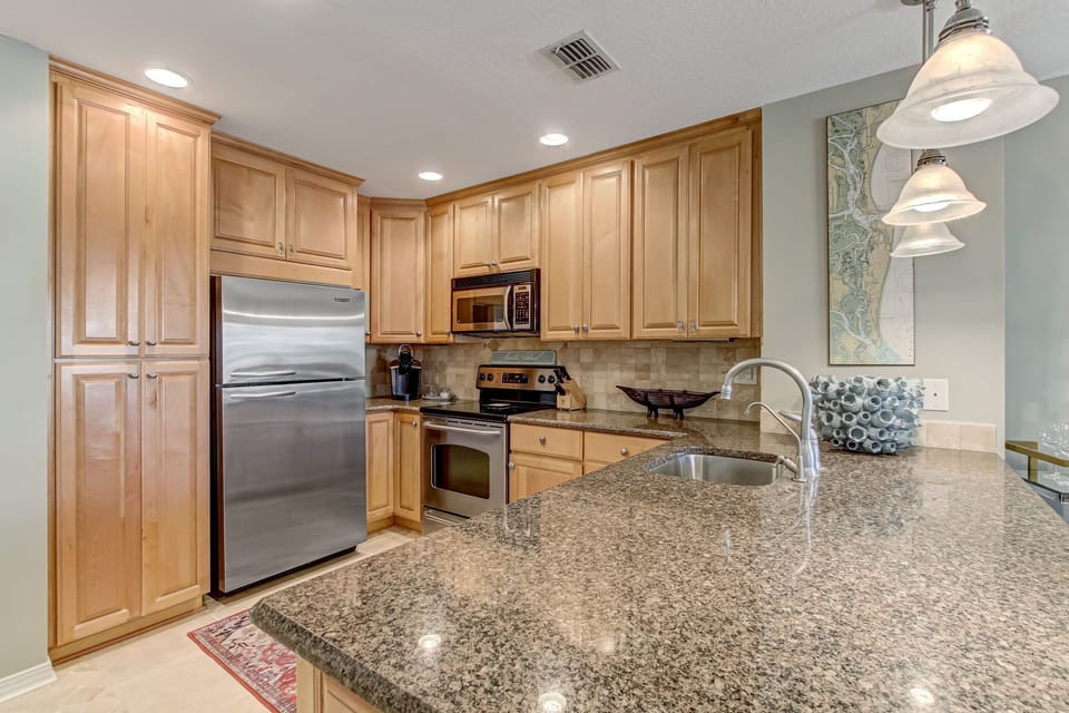 Fully Equipped Kitchen with Stainless Steel Appliances and Stunning Granite Countertops