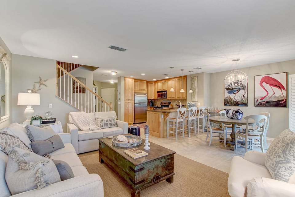Living Space with Ample Seating and a Large Flat Screen Smart TV
