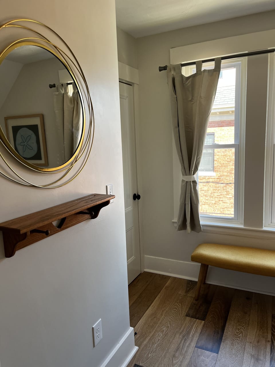 Cozy Queen detail, mirror, shelf for keys/phone. Dresser in closet.