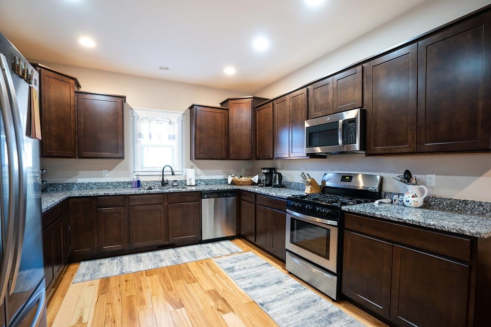 Kitchen - Cook in our large, fully-stocked kitchen with updated appliances. 
