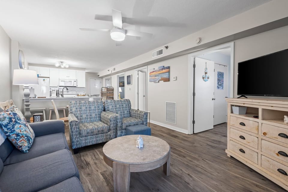 Open-concept layout offers seamless flow from kitchen to dining to living space.