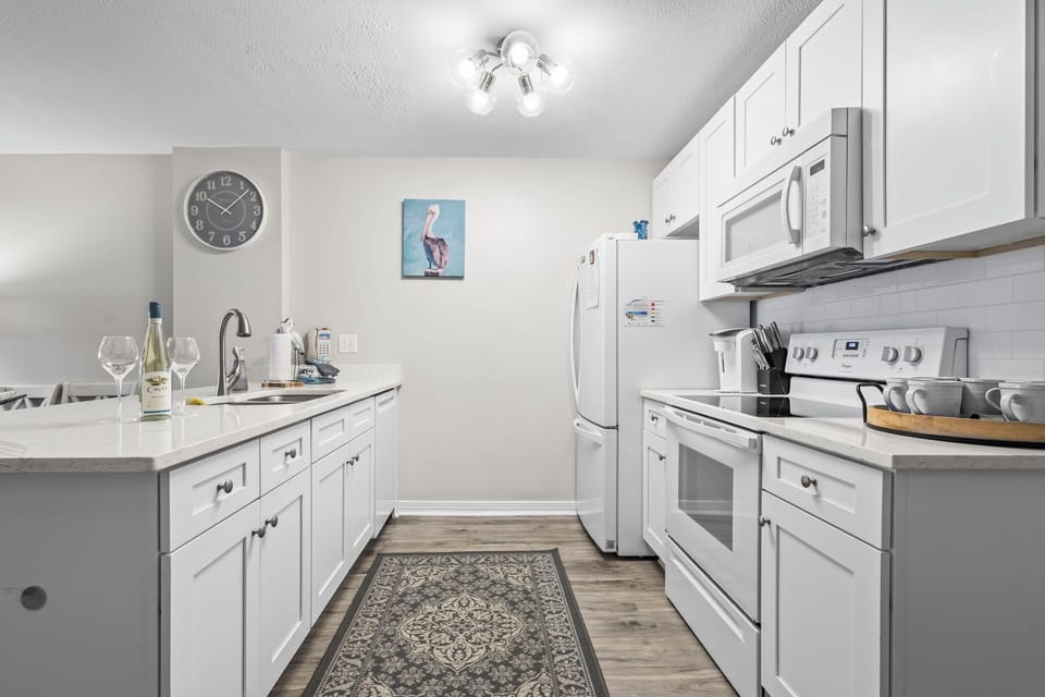 Fully equipped kitchen with modern appliances—perfect for home-cooked meals.