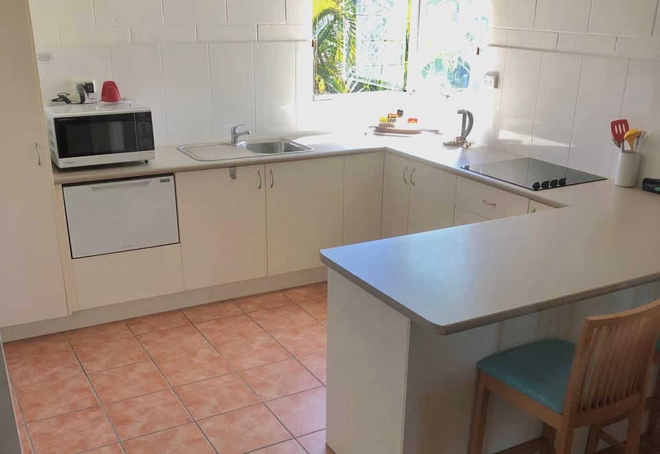 Spacious kitchen includes cook top, microwave and dishwasher