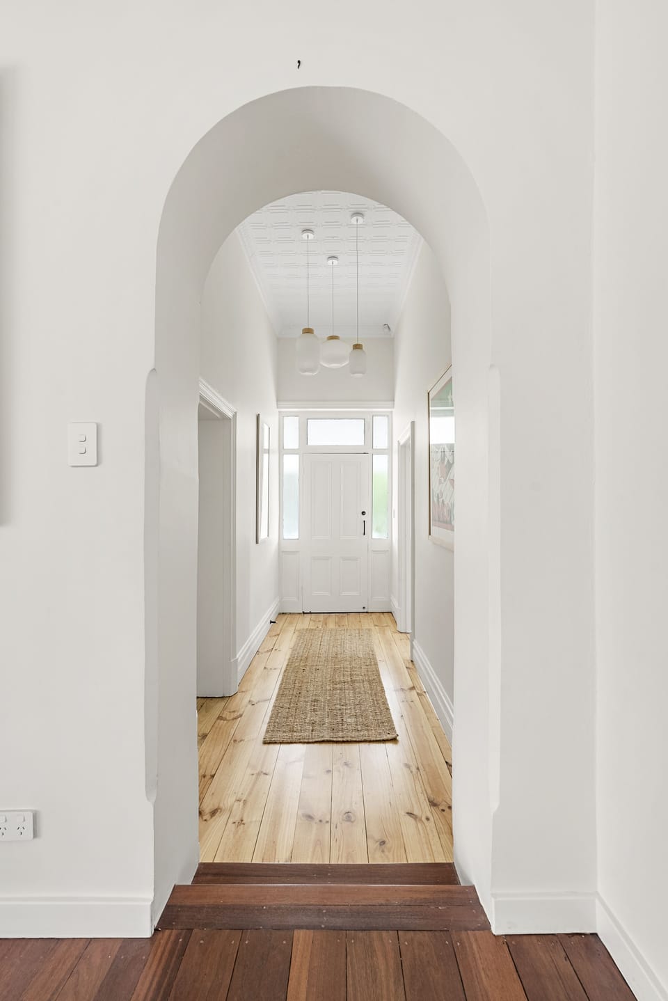 Central hallway with original wood floors