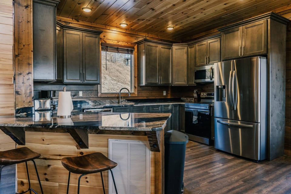 Fully furnished kitchen with stainless steel appliances. 