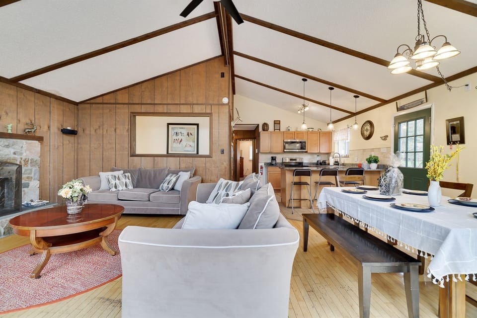 View of the living room, dining room, and kitchen. 