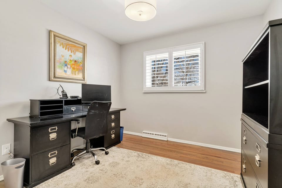 The office is down the hall from the living room.