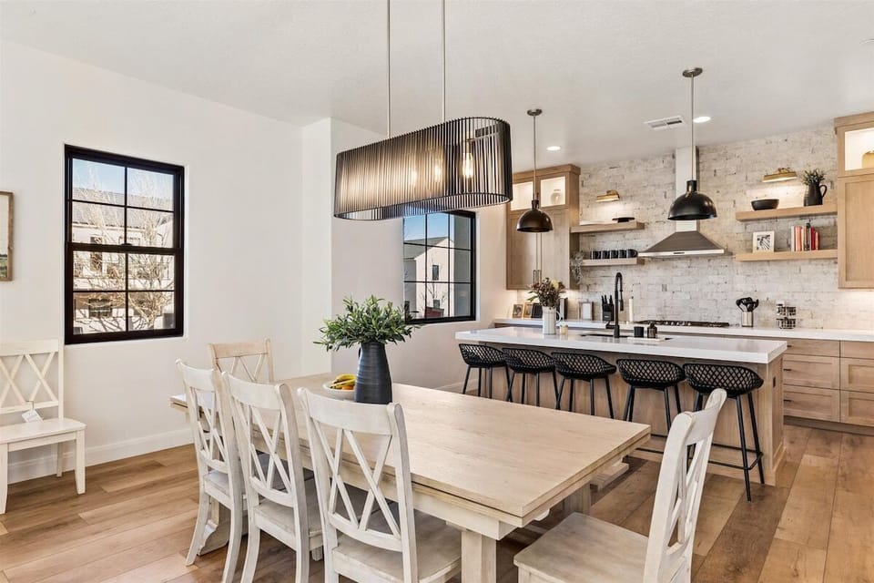 Large table with extenders on each side and extra chairs for larger groups.