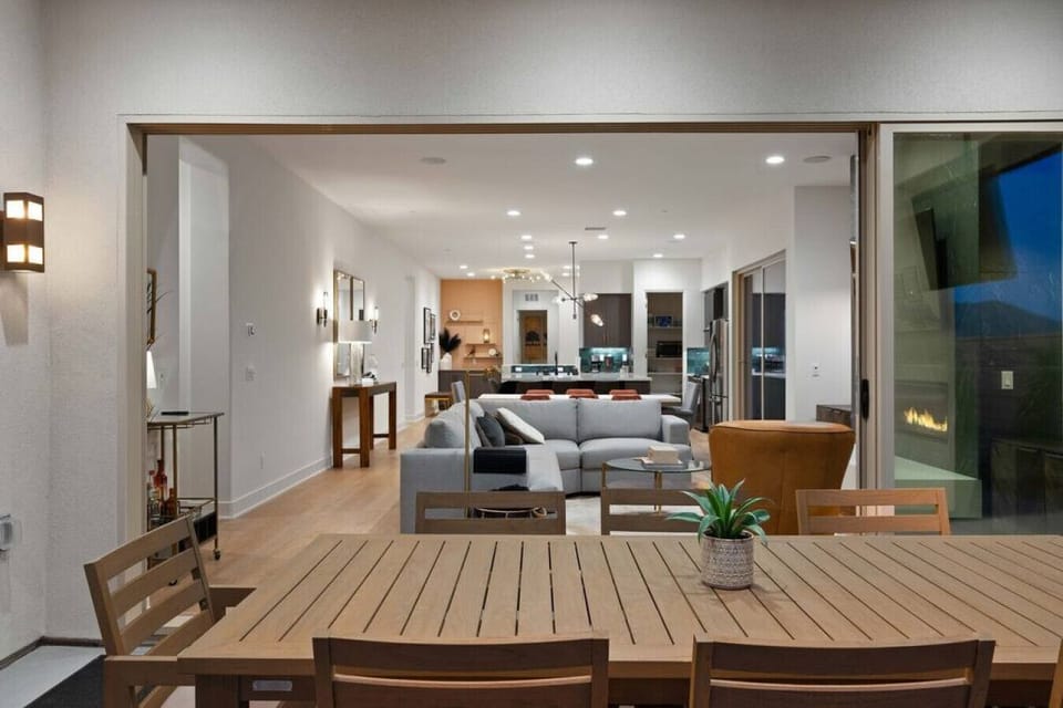 Open living space flowing to the patio, blending indoor comfort w/ outdoor living
