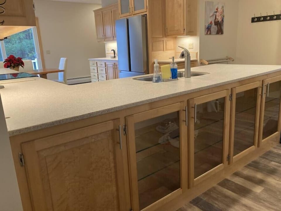 Custom birdseye maple cabinets throughout the space