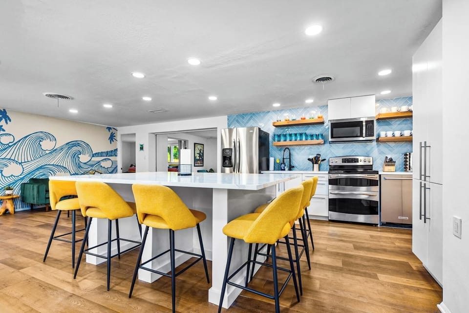 Newly remodeled kitchen with full slab quartz countertop, seating for 8. 
