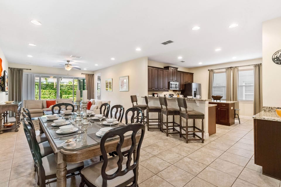 Elegant Dining and Kitchen of the Home in Kissimmee Florida - Perfect blend of elegance and functionality - 8 Persons Dining - Open concept connecting the kitchen to the dining