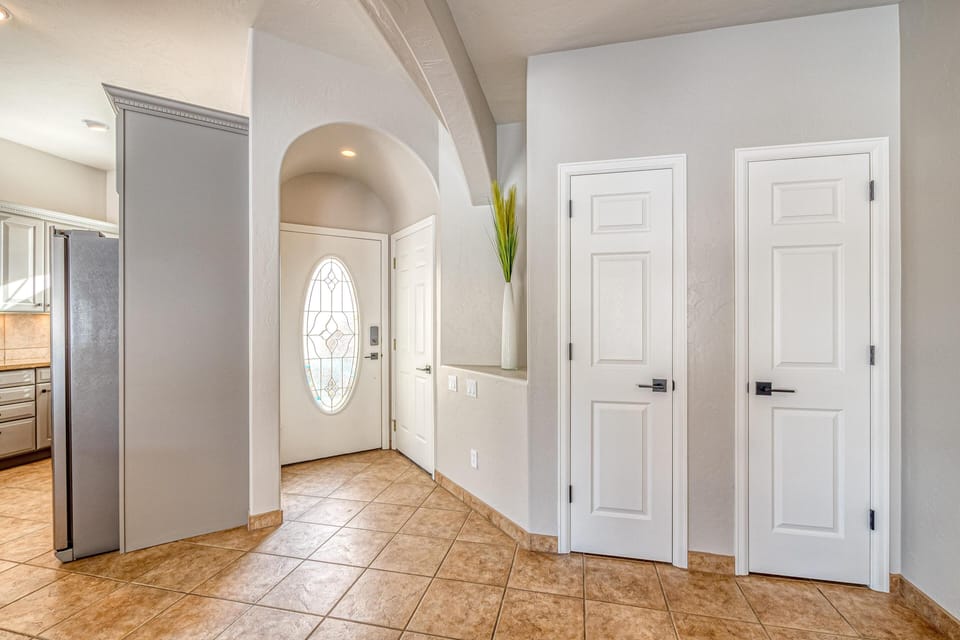The entryway offers plenty of storage and open access into the living room and kitchen.
