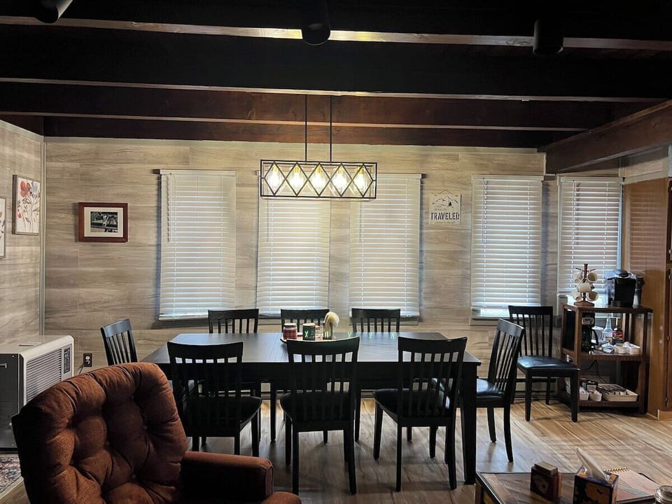 New Large Dining Table with Plenty of chairs open to Living Room and Kitchen.