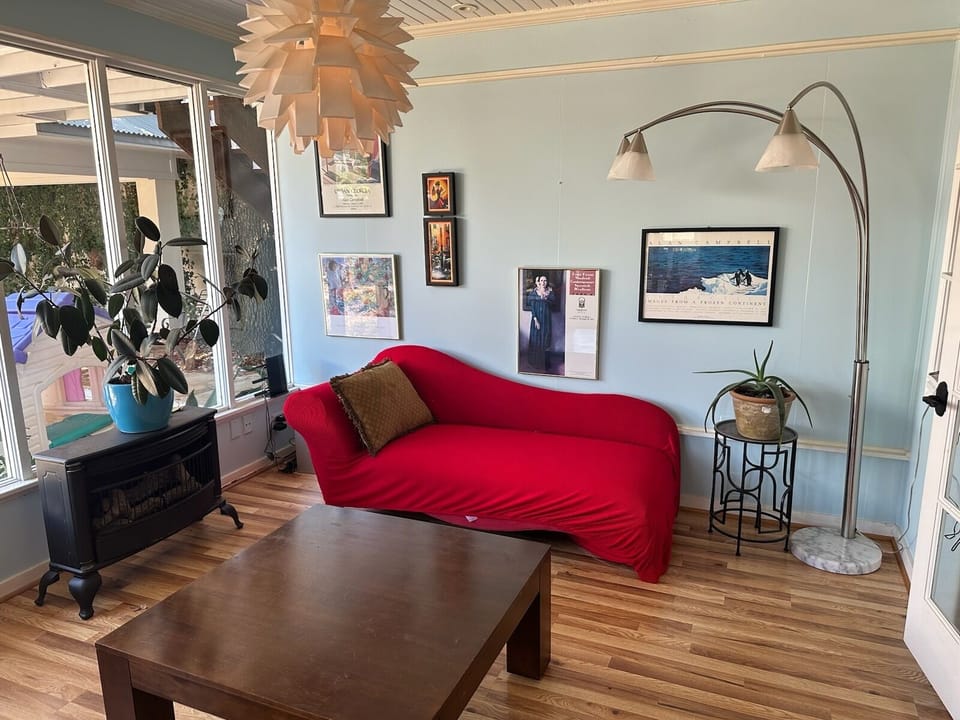 Sunroom with an exit to the patio and pool area.