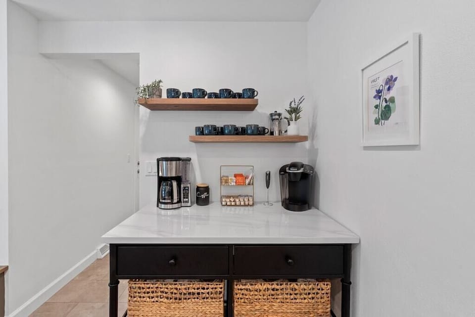 Coffee bar stocked for both single pods & full pot brewing.