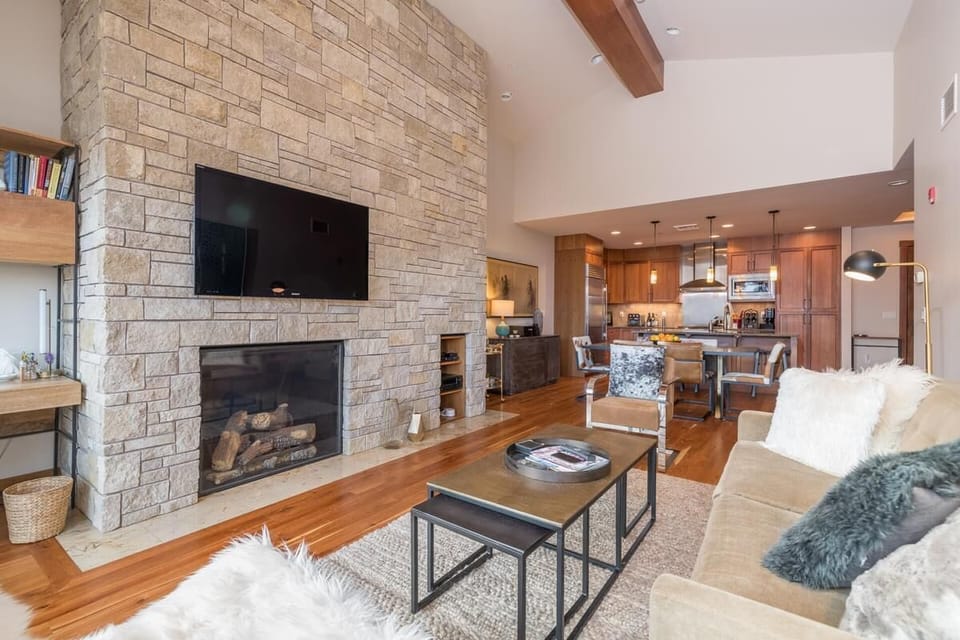 Large flat screen TV above the fireplace