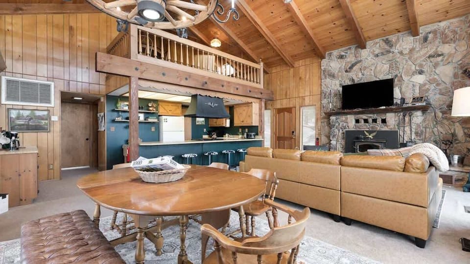 The great room features the living room, dining, bar seating, and kitchen.