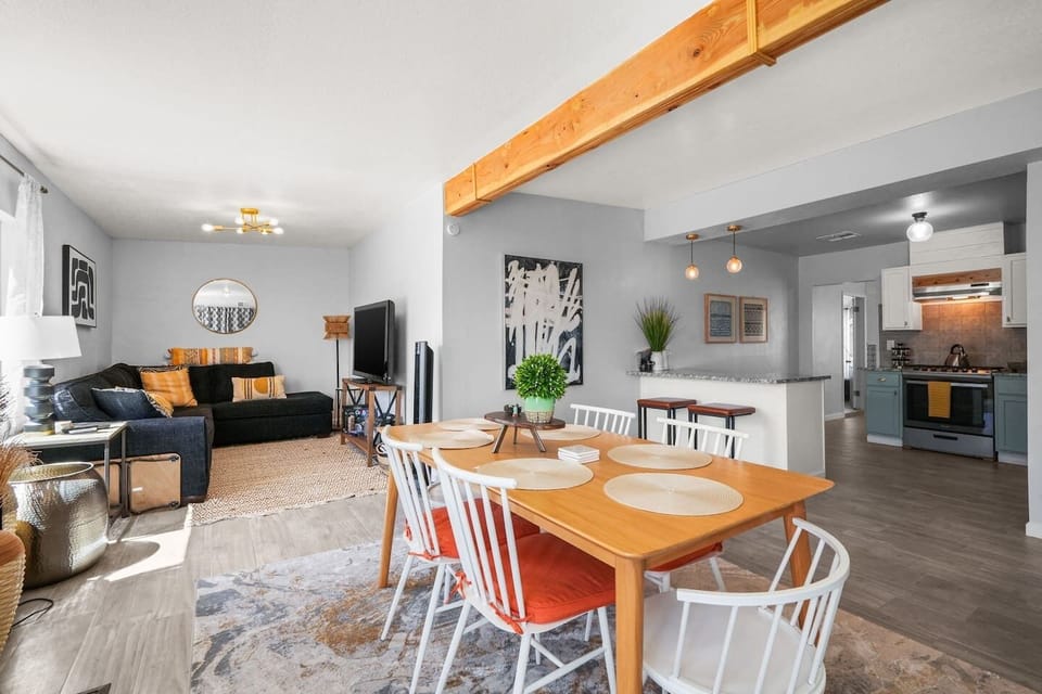 Open floor plan with kitchen, dining, and den