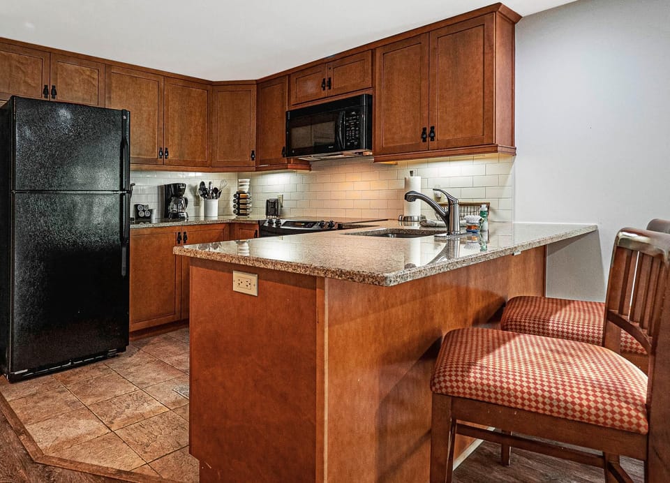 Full kitchen with a full size fridge