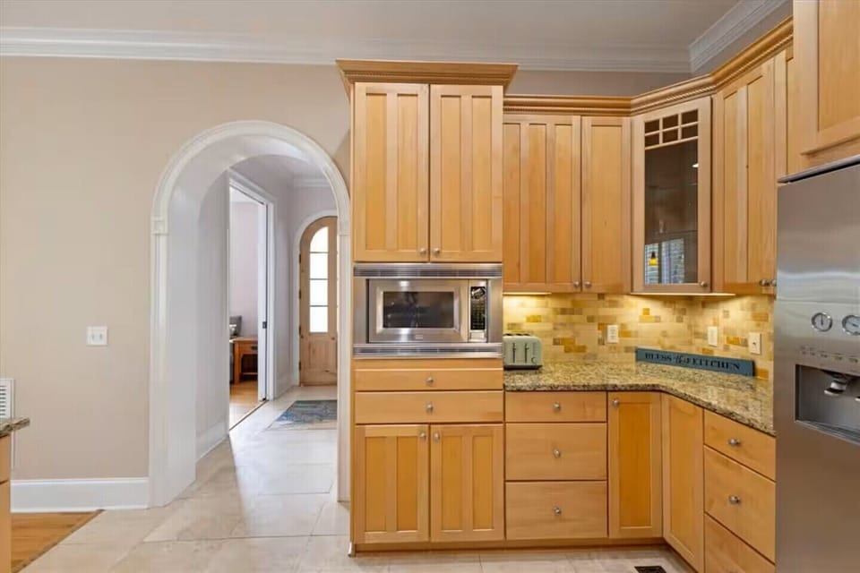 Kitchen looking towards staircase door and bonus room.