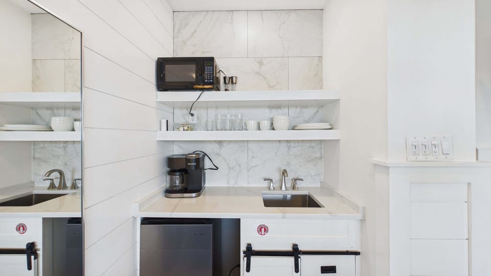 Kitchenette in studio with Keurig coffee maker and microwave