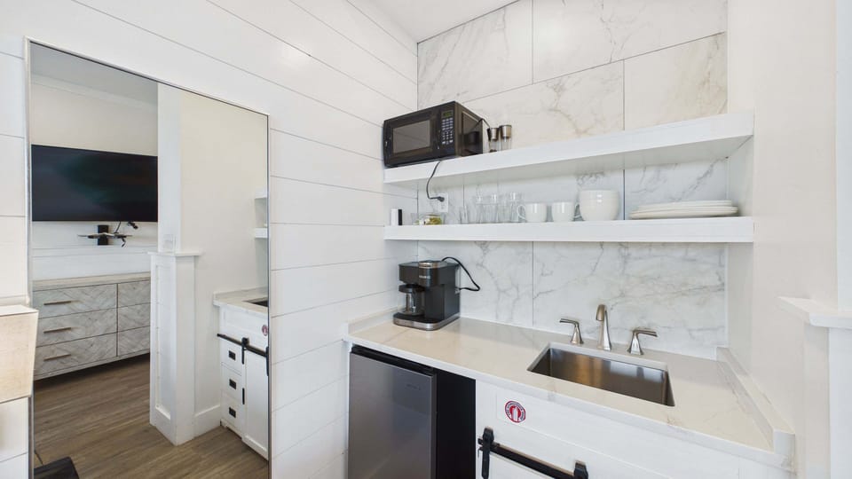 Kitchenette in studio with Keurig coffee maker and microwave