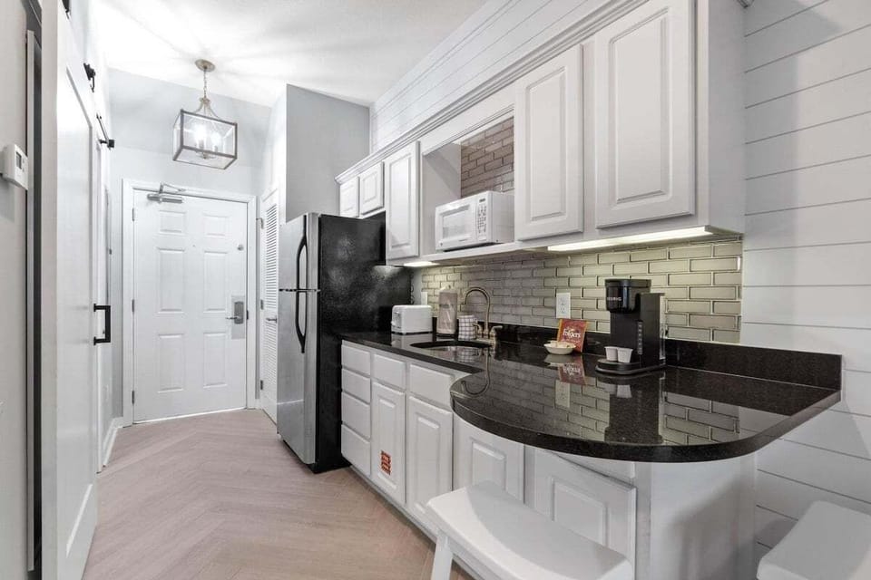 Kitchenette with seating area and full size refrigerator