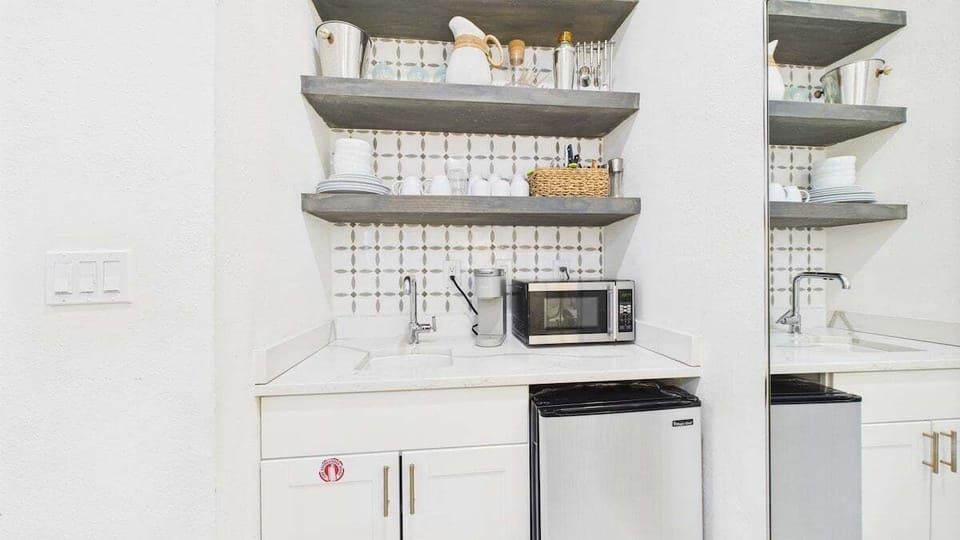 Kitchenette with microwave and under counter refrigerator