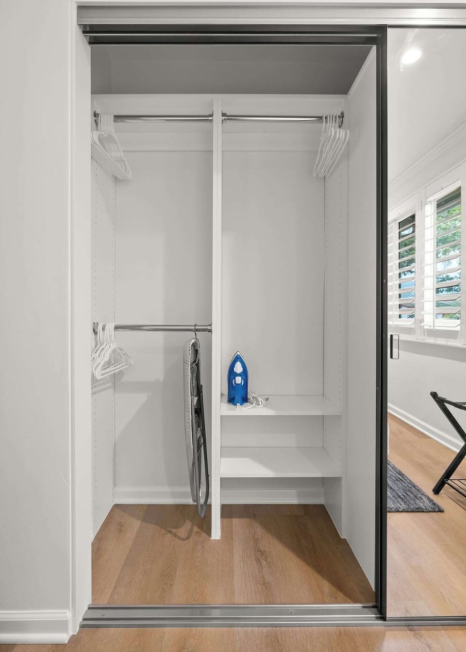 Closet Space with Iron, Ironing Board, Heater, and Blankets