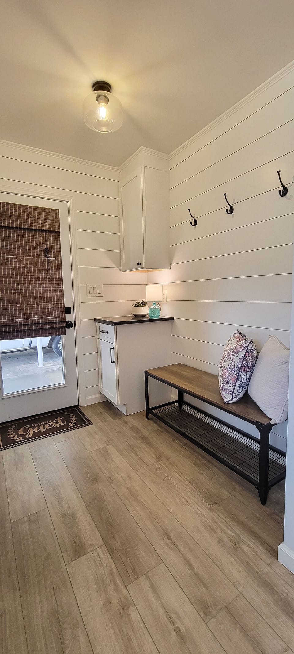 Mudroom/Entrance.  Space for charging phones, shoes and coats.