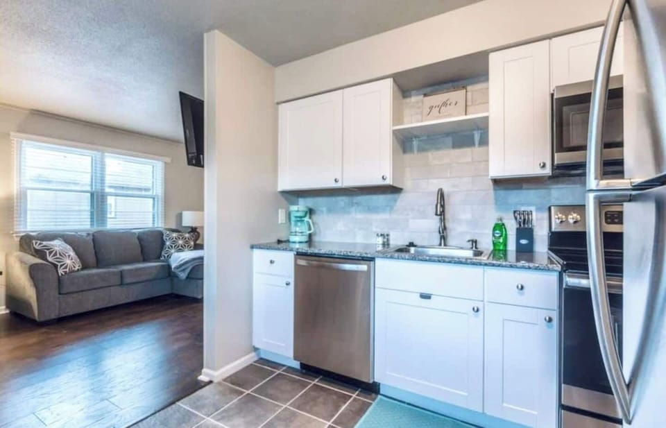 From the pristine cabinets to the gleaming backsplash, every detail reflects a commitment to beauty and functionality. 